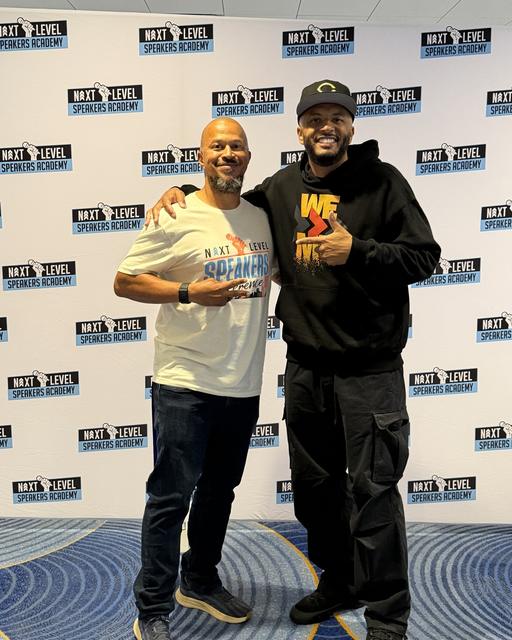 Jabari Sims posing with a fellow speaker